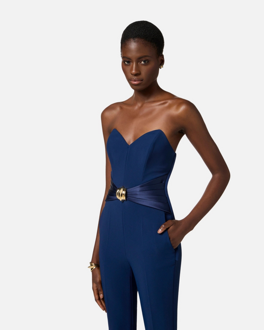 Tuta in crêpe fluido con macro fiocco