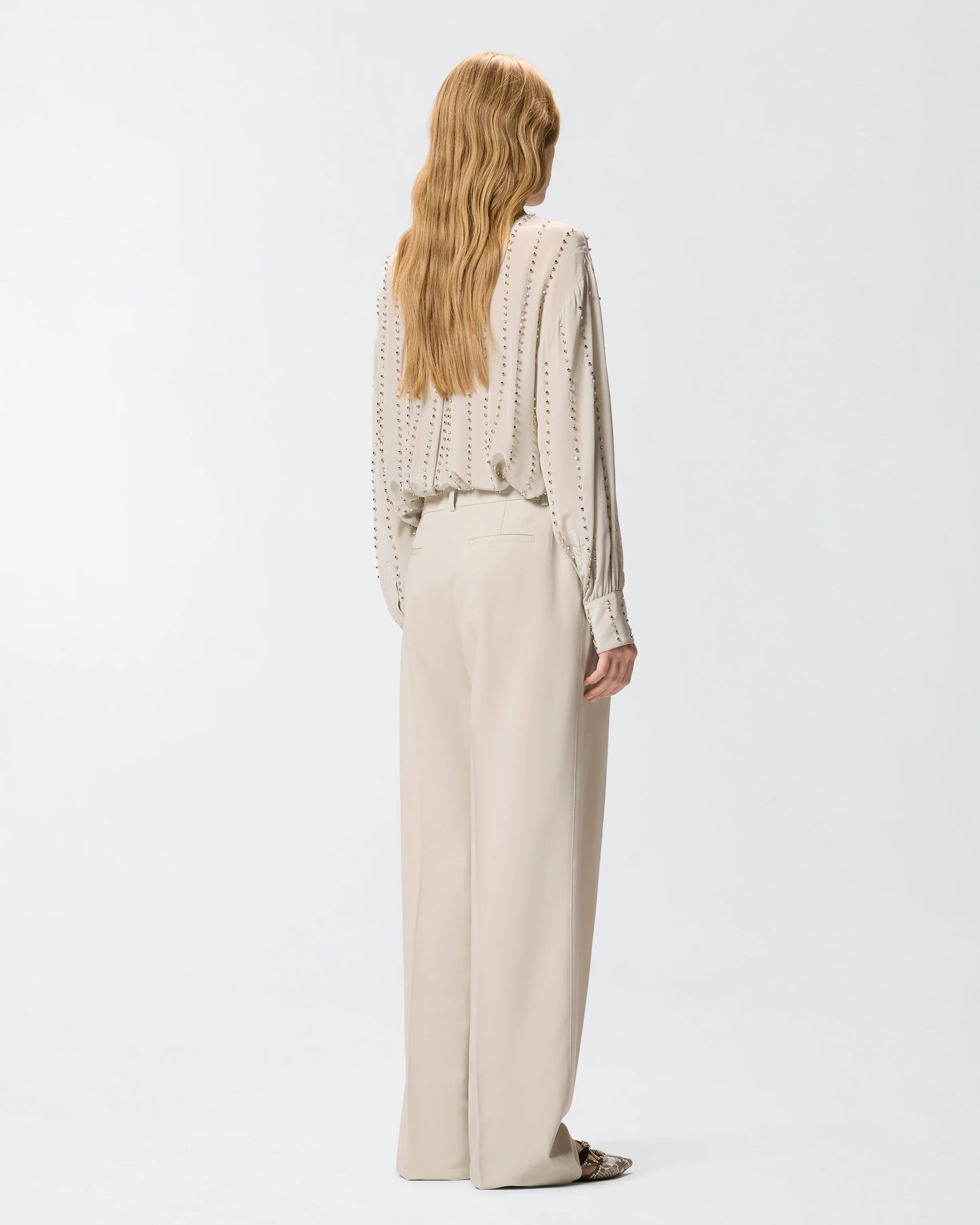 Pantaloni fluidi con piega stirata
